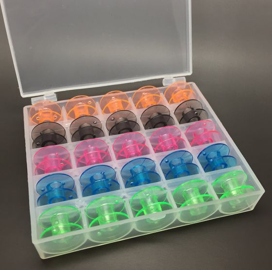 25 coloured bobbins in a box
