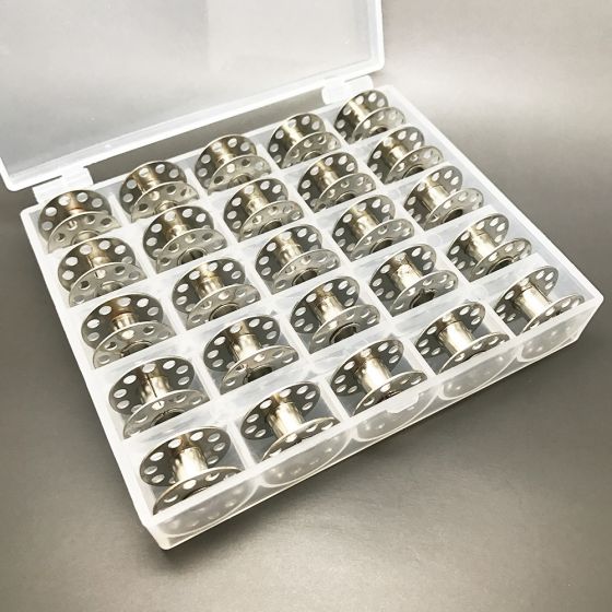 25 Metal bobbins in a box